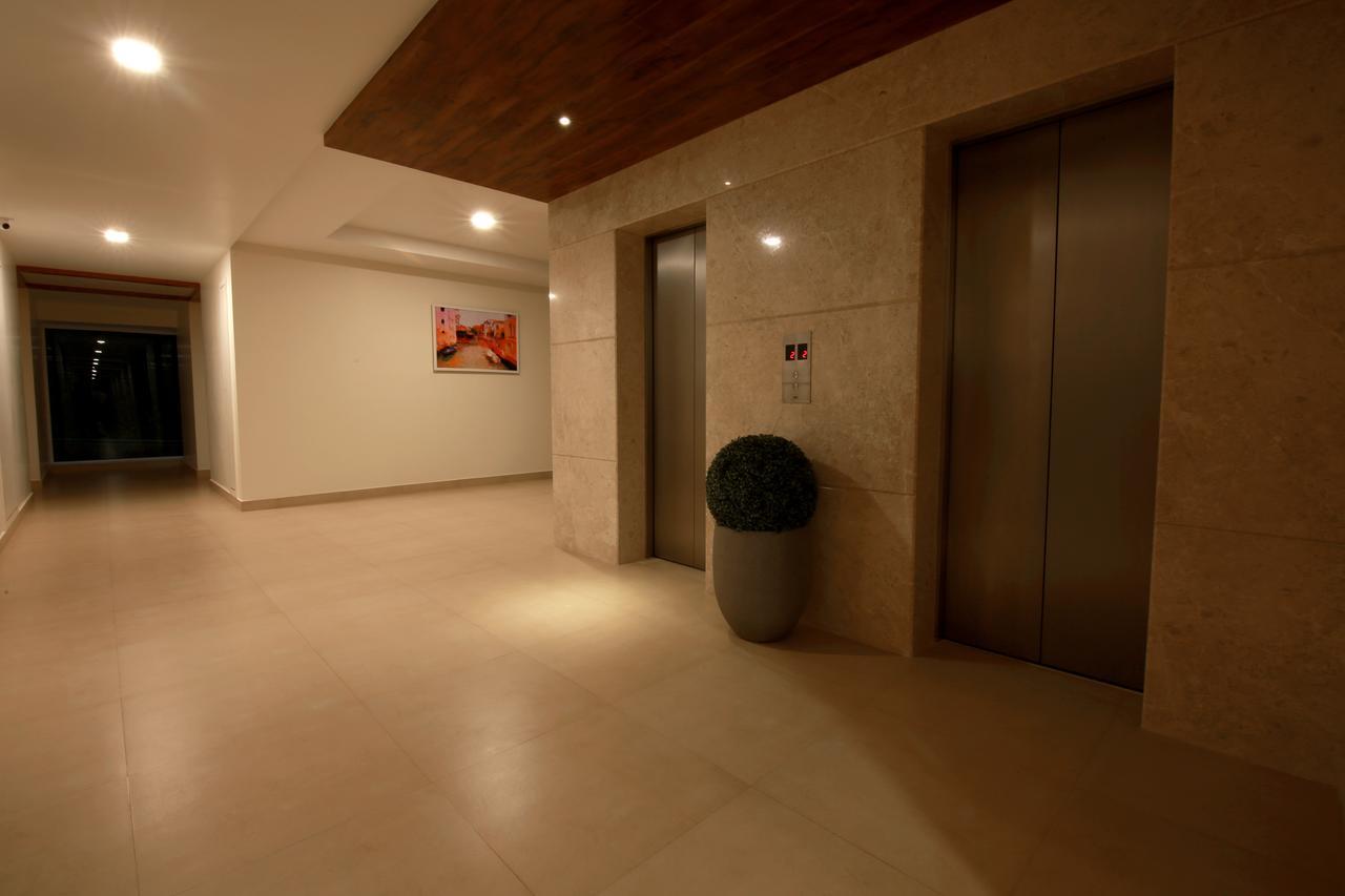 ホテル Palguni Residency ハッサン エクステリア 写真